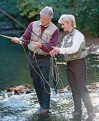 Couple on vacation, fly fishing